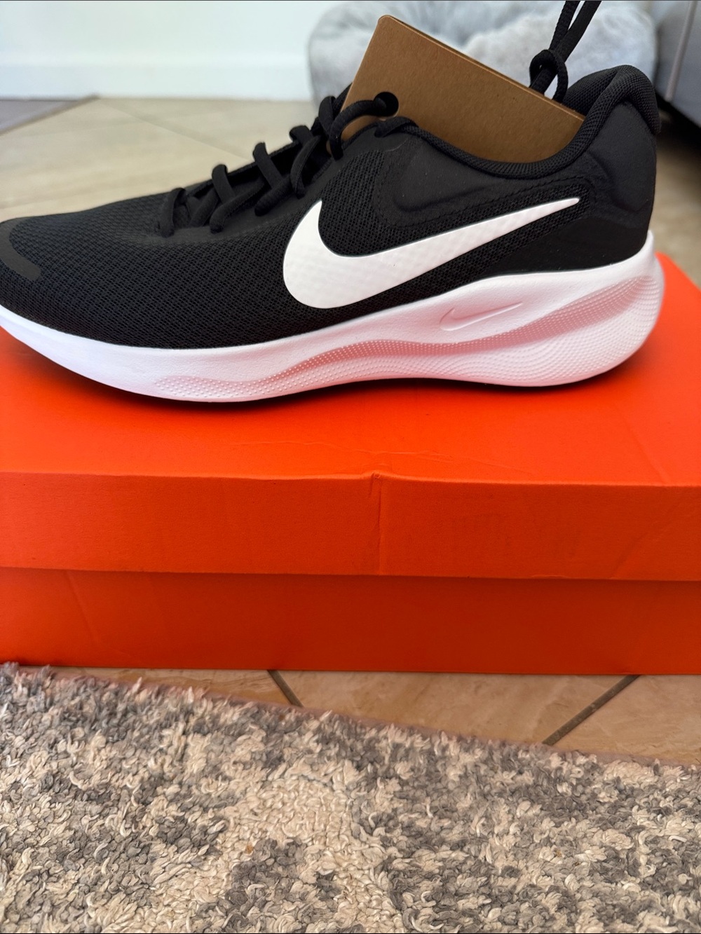 Nike Revolution women’s 9.5/Men's 8 Black and White Lightweight Running Sneaker